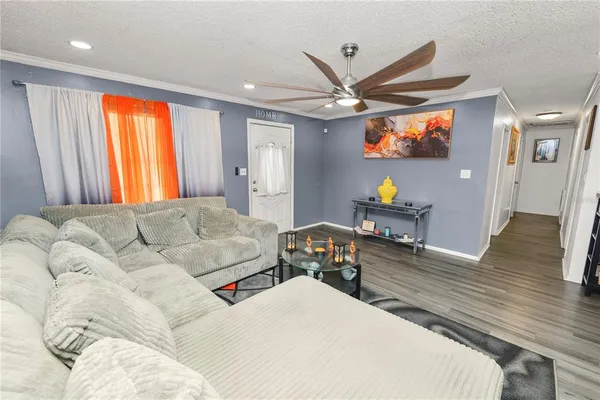 a kitchen with stainless steel appliances granite countertop a refrigerator and a stove