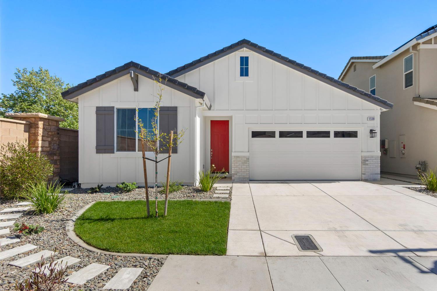 a front view of a house with a yard