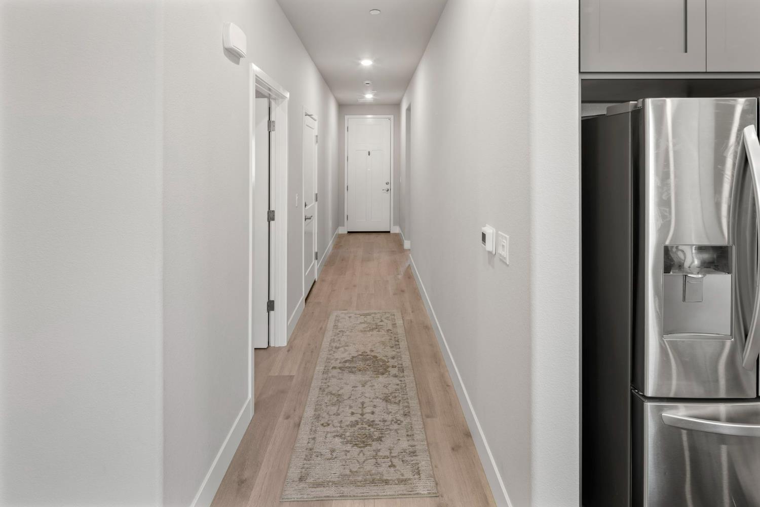 1508 Westwind Way Rocklin, CA 95765 - Photo 16 of 45 a view of a hallway with a refrigerator
