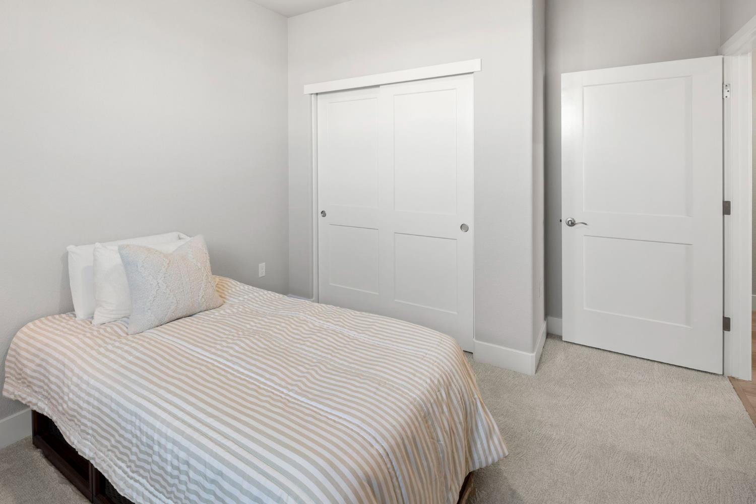 1508 Westwind Way Rocklin, CA 95765 - Photo 23 of 45 a bedroom with a bed and a mirror