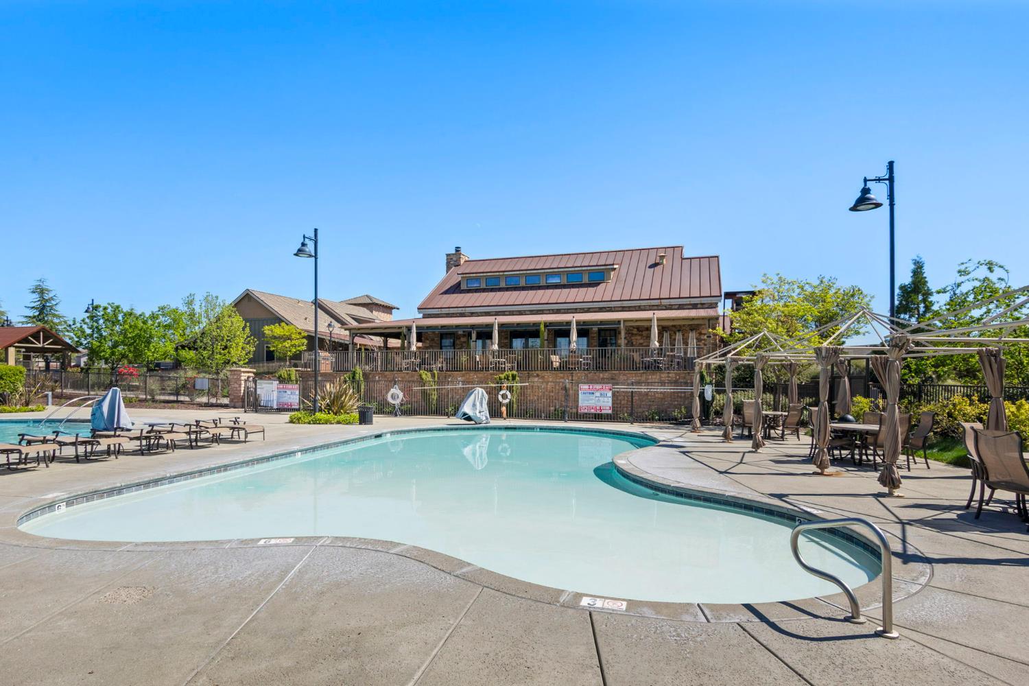 1508 Westwind Way Rocklin, CA 95765 - Photo 40 of 45 a view of a swimming pool with outdoor seating