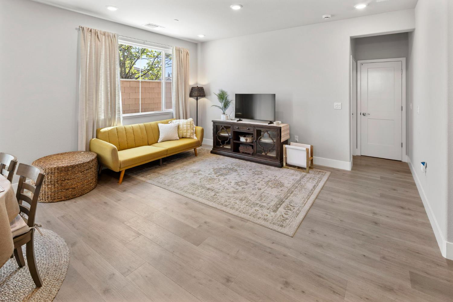 1508 Westwind Way Rocklin, CA 95765 - Photo 8 of 45 a living room with furniture and a flat screen tv