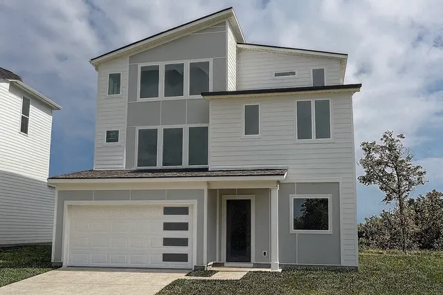 a view of a house with more windows and brick walls