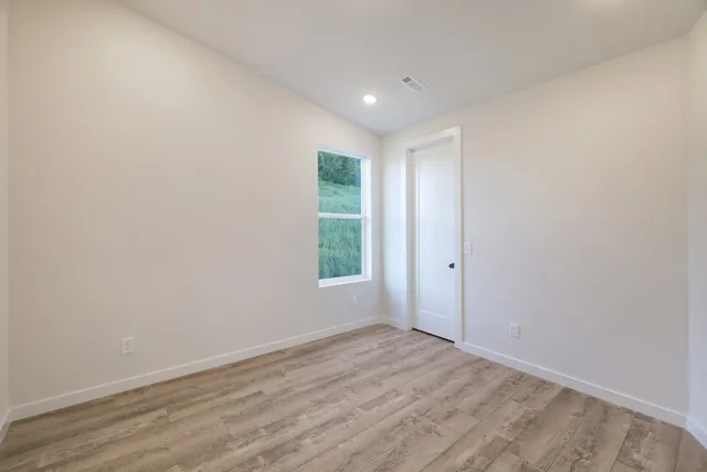 a view of small space with wooden floor