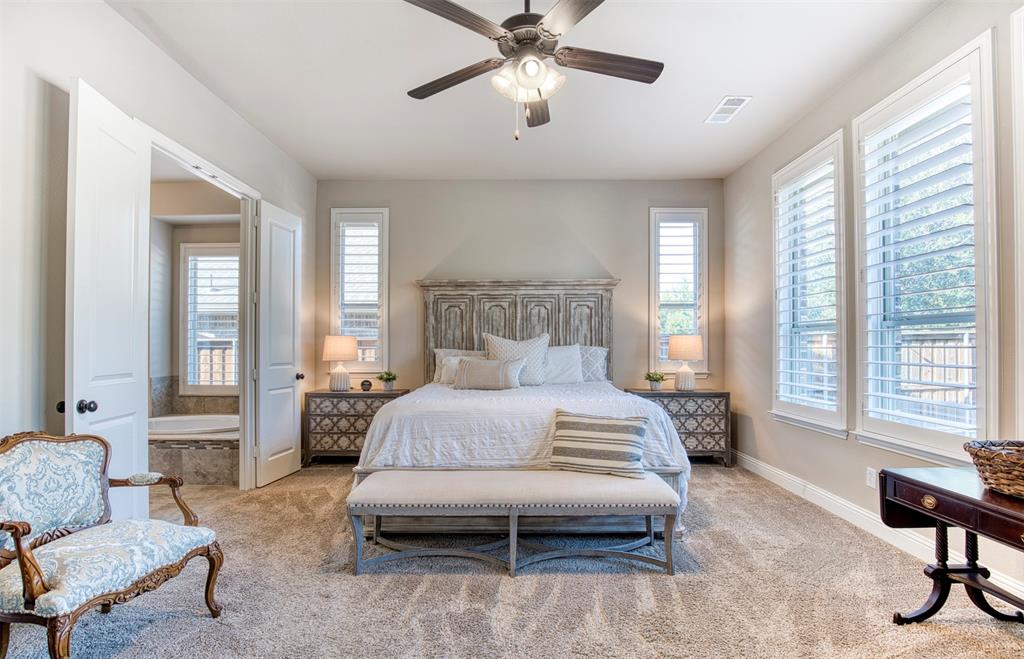 7760 Hackamore Street Frisco, TX 75036 - Photo 16 of 40 Private primary suite with windows overlooking the backyard enclosed with plantation shutters.