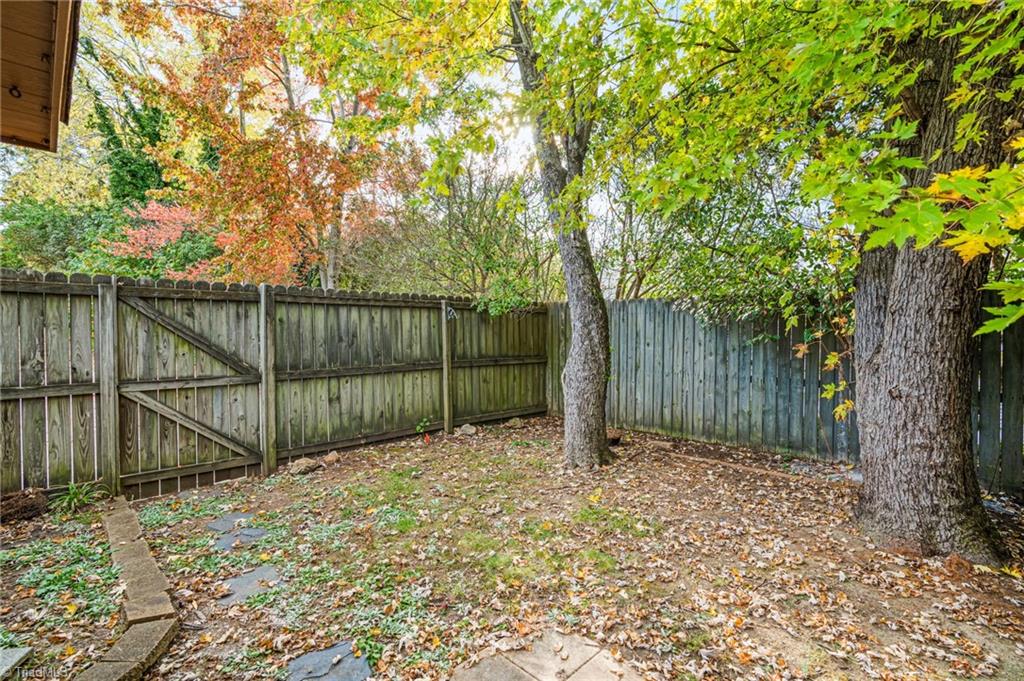 1827 Johnson Street, Unit A High Point, NC 27262 - Photo 24 of 29 Fenced yard with so much wooded Privacy