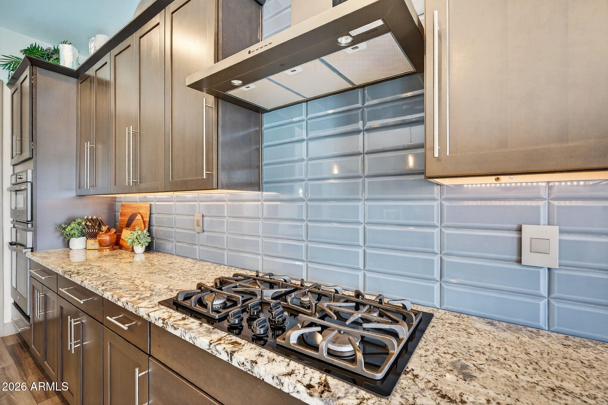 35112 North Jacobs Road San Tan Valley, AZ 85144 - Photo 20 of 80 a kitchen with a stove and a cabinets