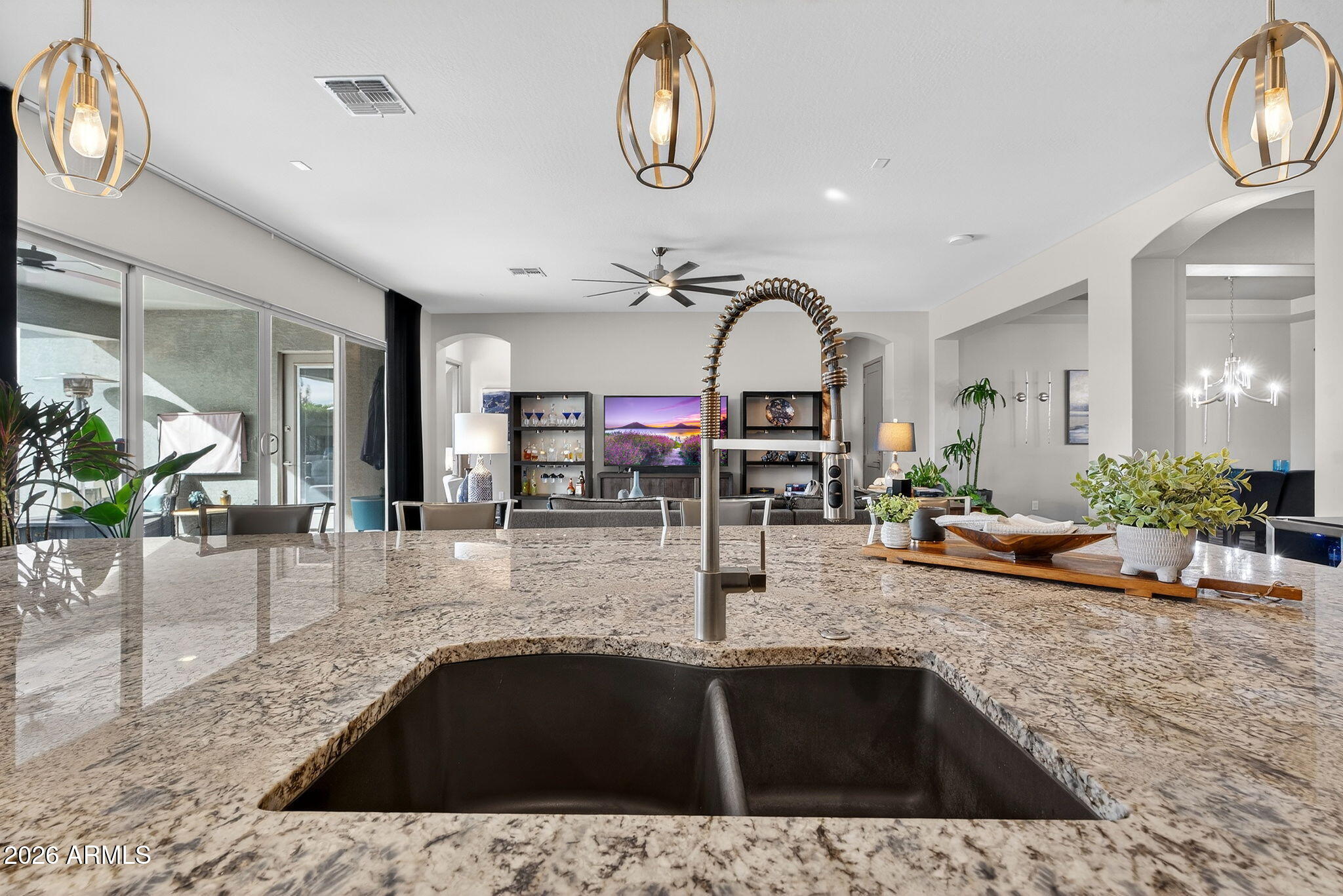 35112 North Jacobs Road San Tan Valley, AZ 85144 - Photo 21 of 80 a kitchen with a sink a counter and chairs