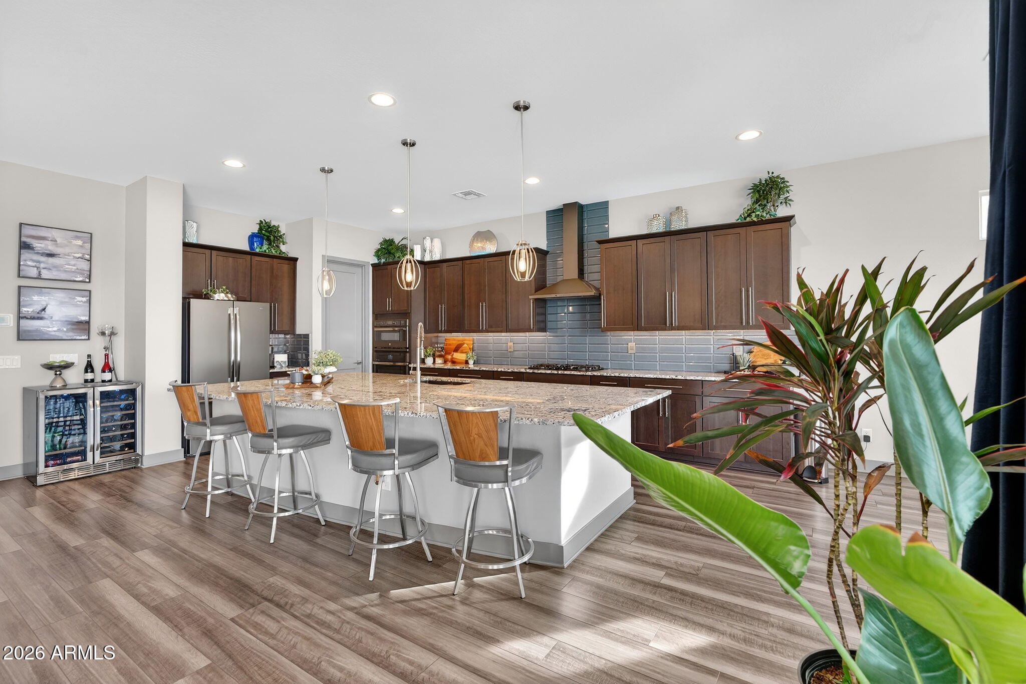 35112 North Jacobs Road San Tan Valley, AZ 85144 - Photo 23 of 80 a view of a dining room with furniture a potted plant and wooden floor