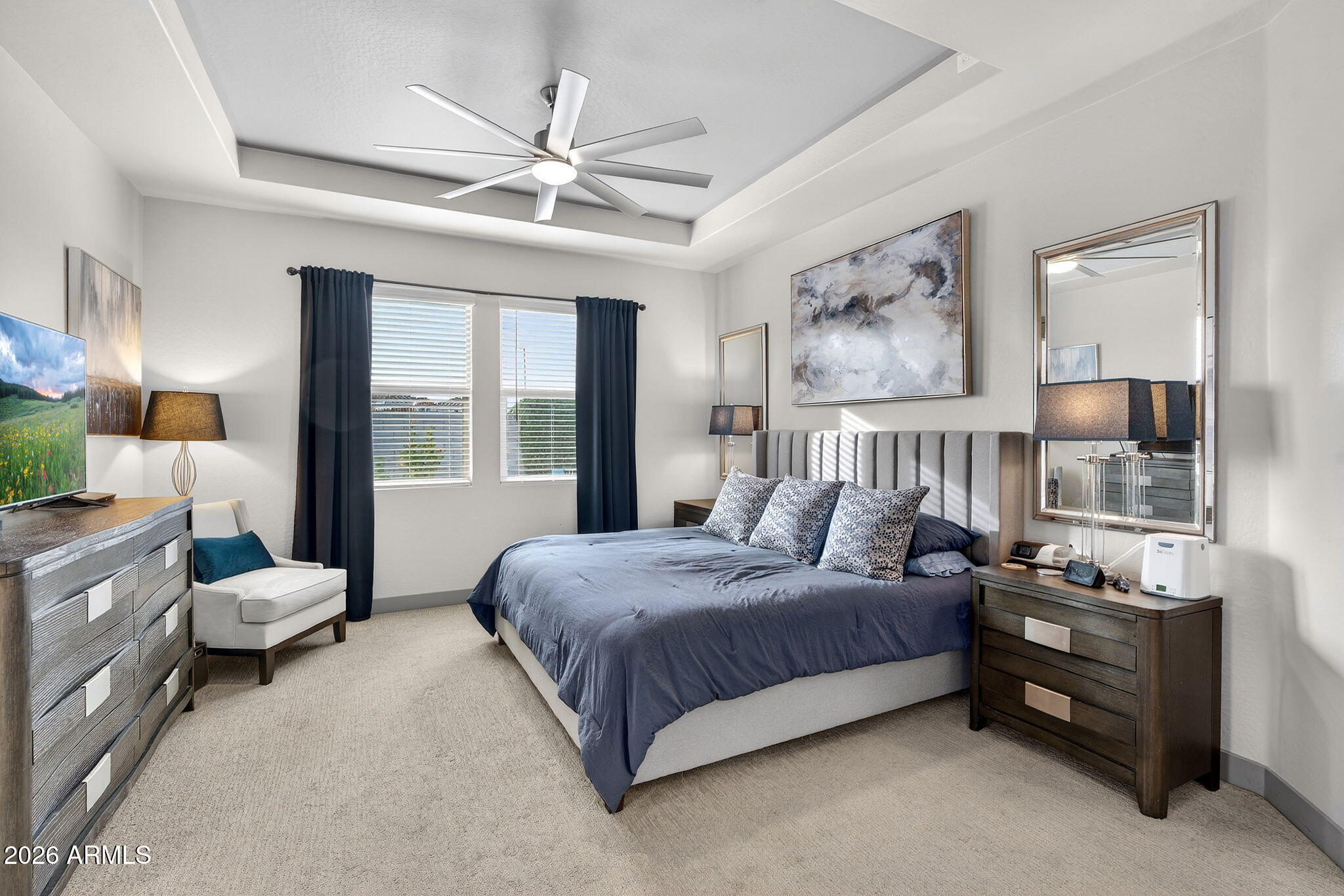 35112 North Jacobs Road San Tan Valley, AZ 85144 - Photo 30 of 80 a bedroom with a bed and a chandelier