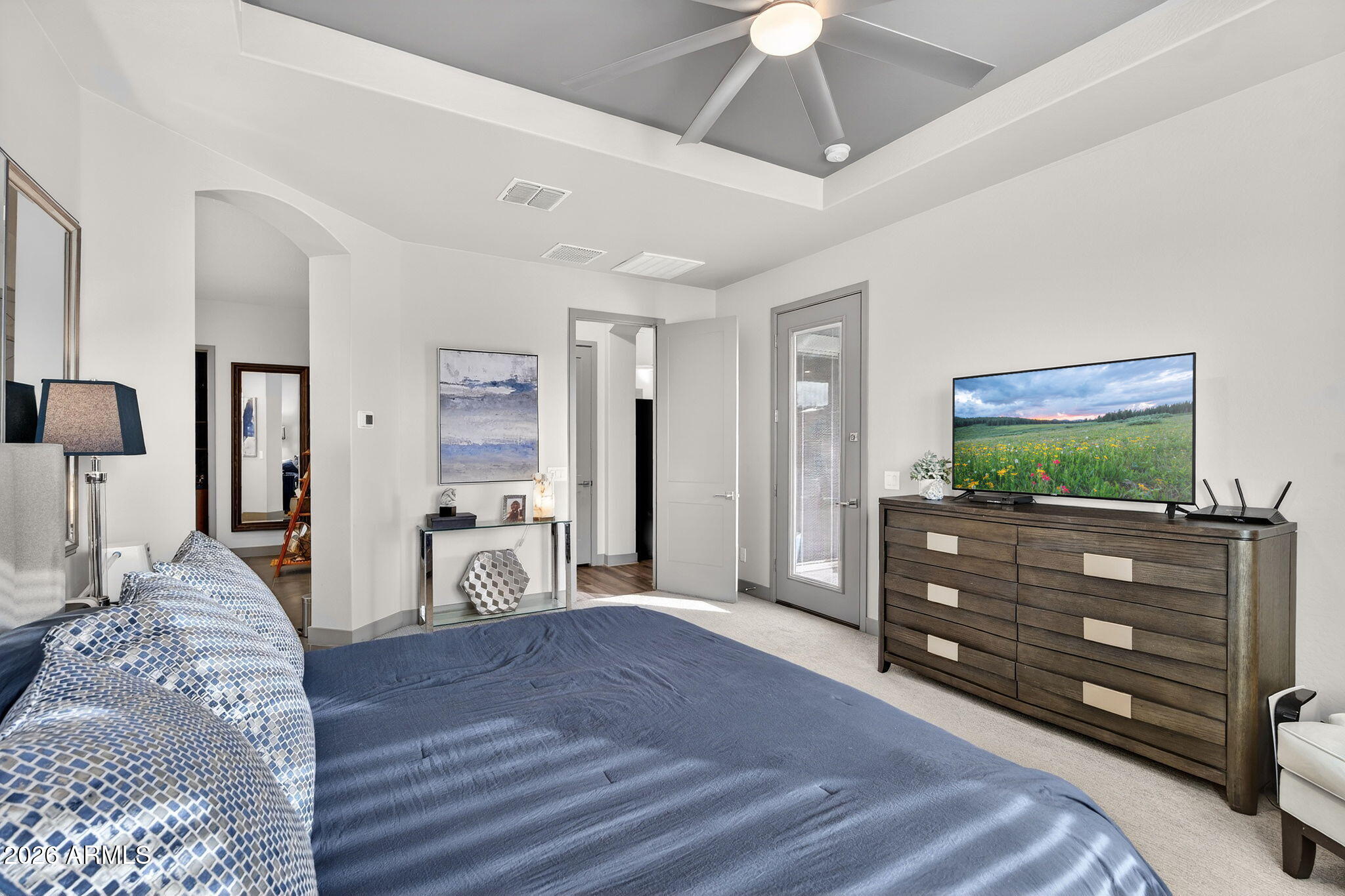 35112 North Jacobs Road San Tan Valley, AZ 85144 - Photo 32 of 80 a bedroom with a bed and a flat screen tv