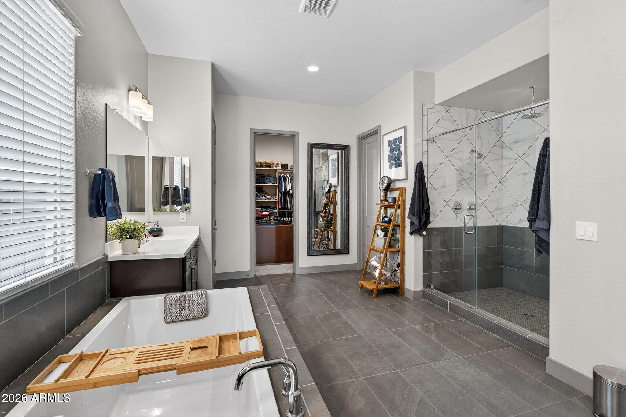 35112 North Jacobs Road San Tan Valley, AZ 85144 - Photo 35 of 80 a large bathroom with a tub a sink and a shower