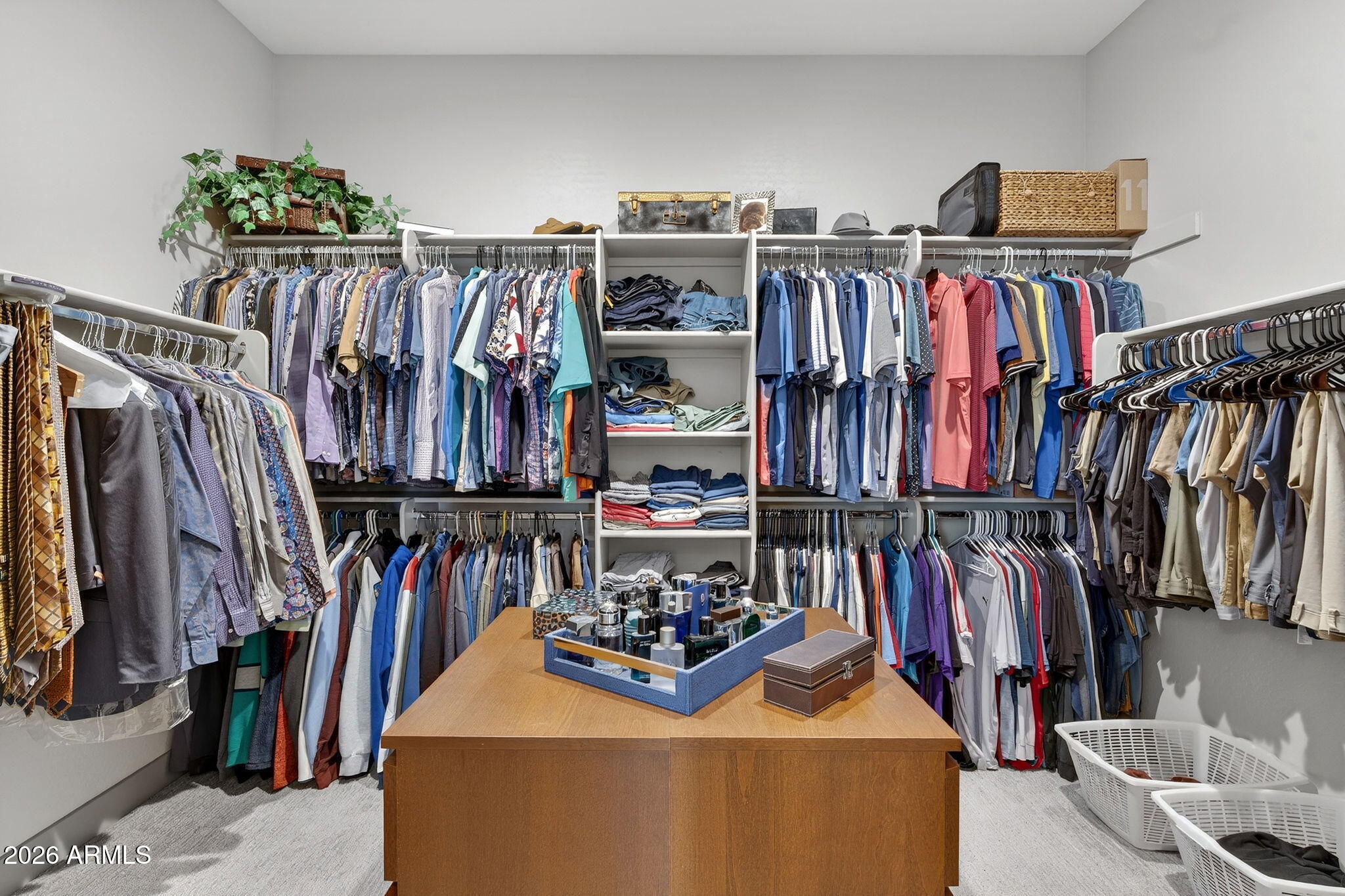 35112 North Jacobs Road San Tan Valley, AZ 85144 - Photo 39 of 80 a view of walk in closet with clothes and shoes