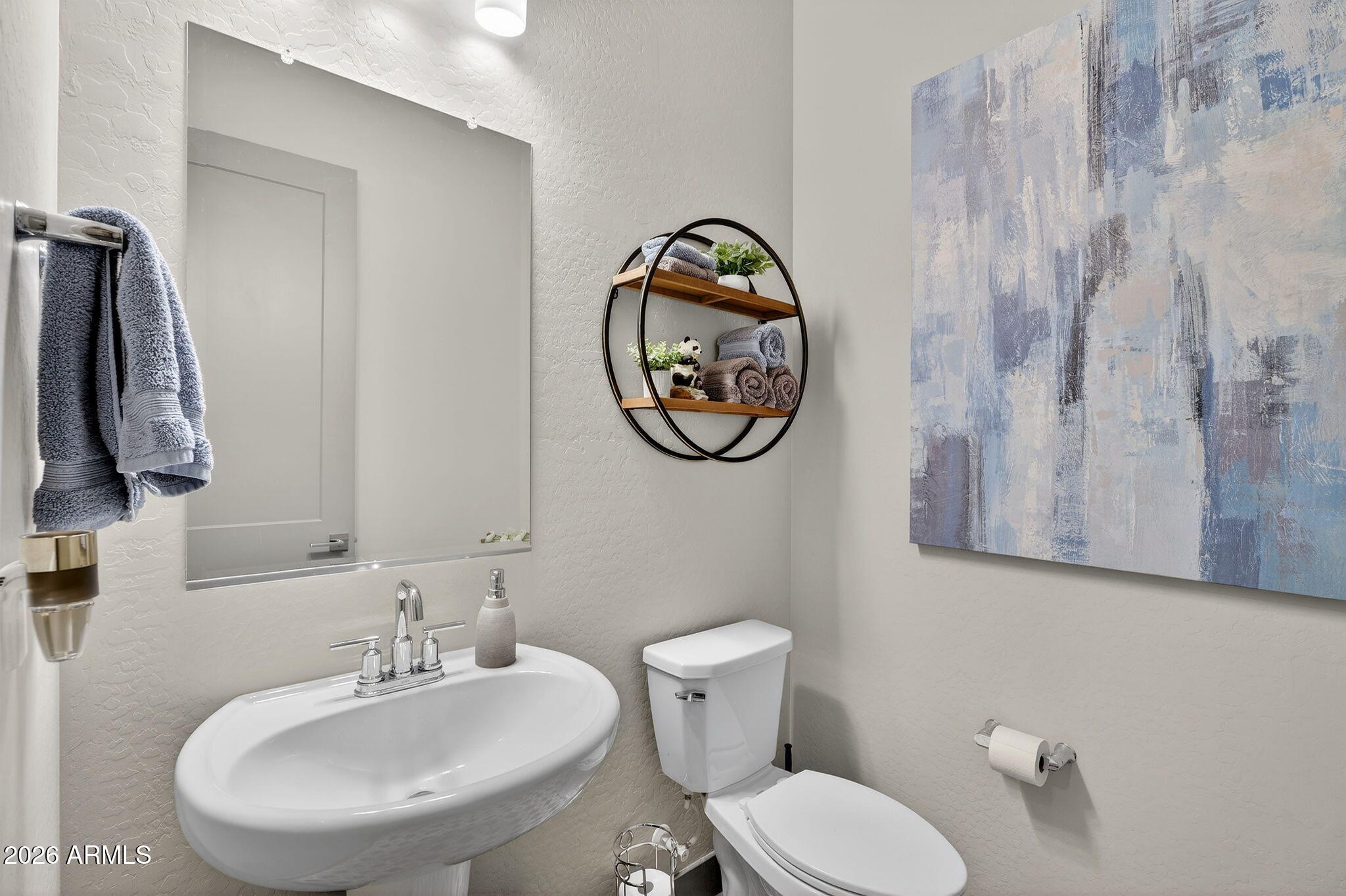 35112 North Jacobs Road San Tan Valley, AZ 85144 - Photo 43 of 80 a bathroom with a toilet sink and mirror
