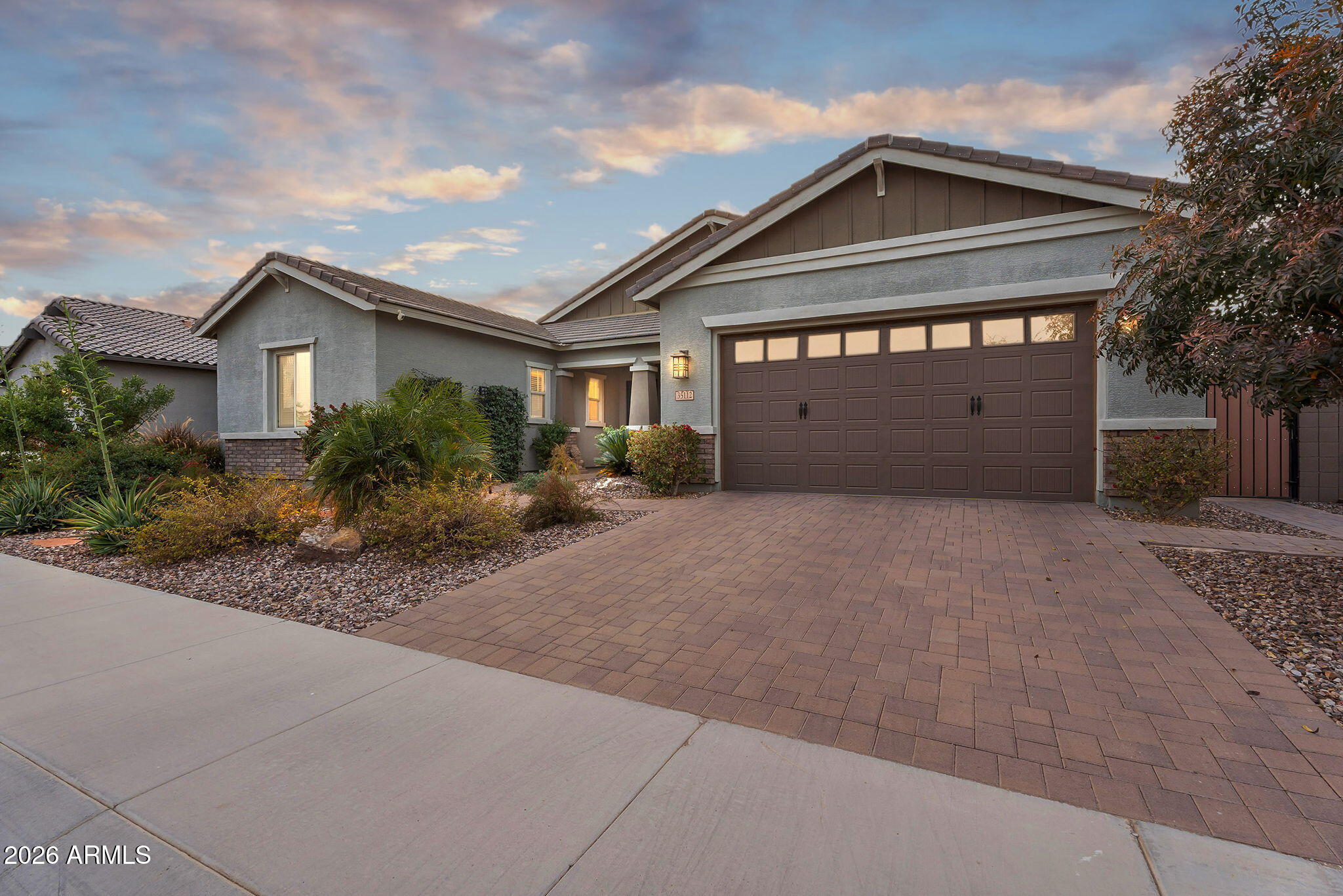 35112 North Jacobs Road San Tan Valley, AZ 85144 - Photo 62 of 80 a front view of a house with a garden and trees