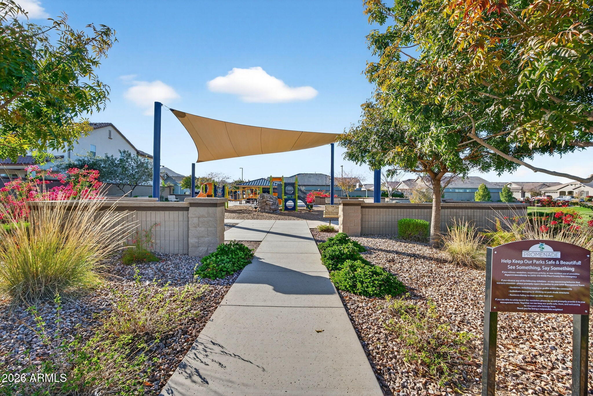 35112 North Jacobs Road San Tan Valley, AZ 85144 - Photo 67 of 80 a view of a pathway with a bench in front of house