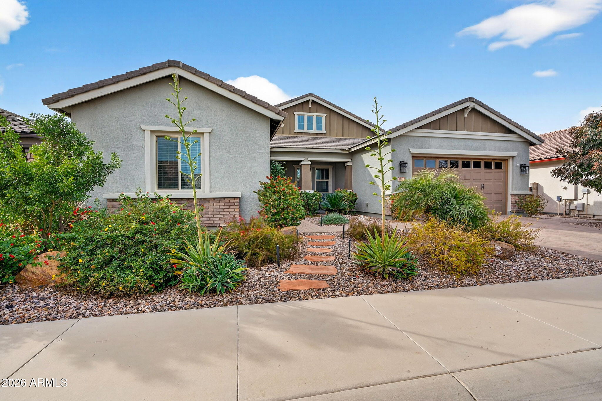35112 North Jacobs Road San Tan Valley, AZ 85144 - Photo 7 of 80 a front view of a house with a yard and garage