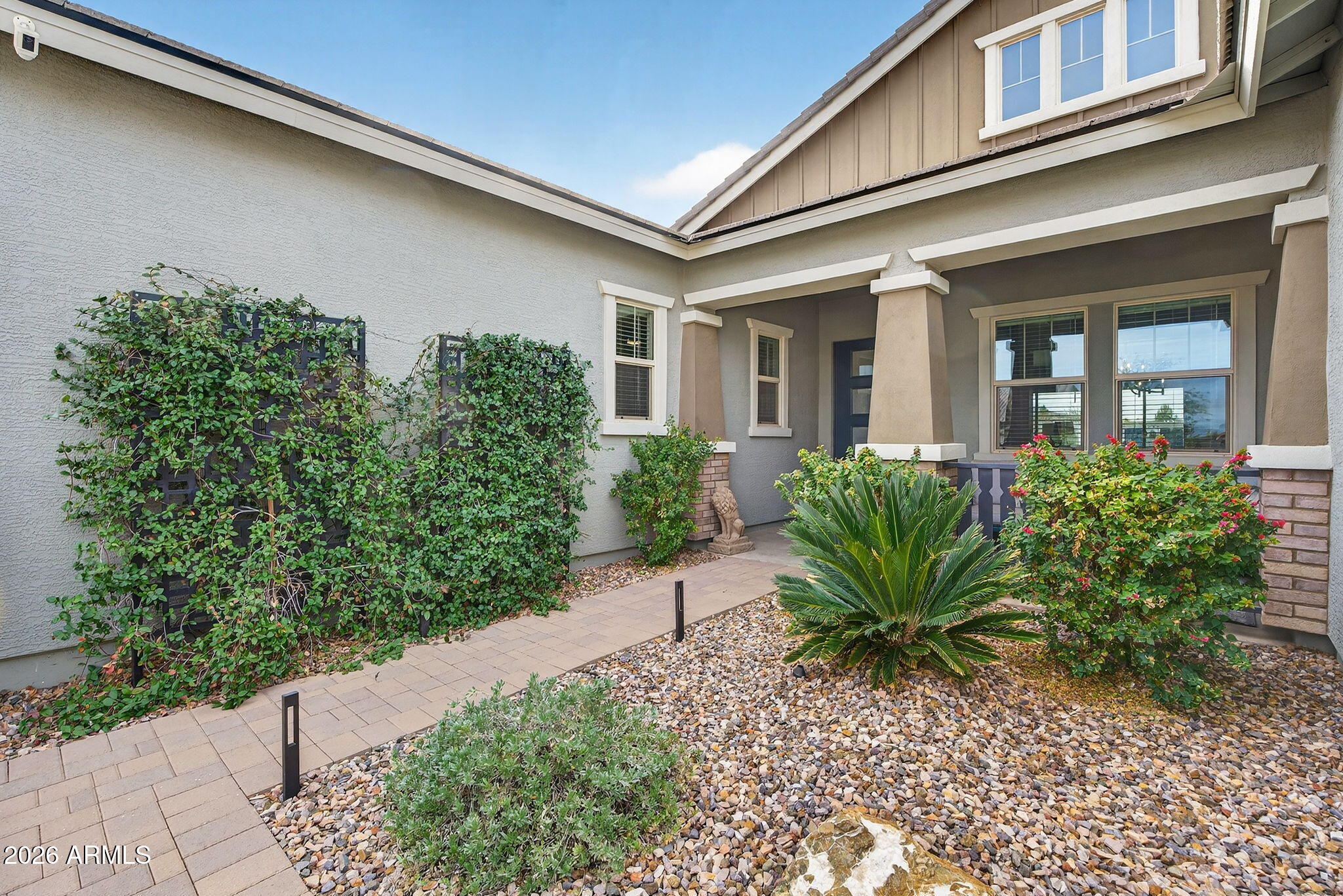 35112 North Jacobs Road San Tan Valley, AZ 85144 - Photo 8 of 80 a view of a house with potted plants