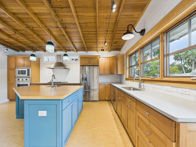 a view of a hallway with wooden floor windows and entryway