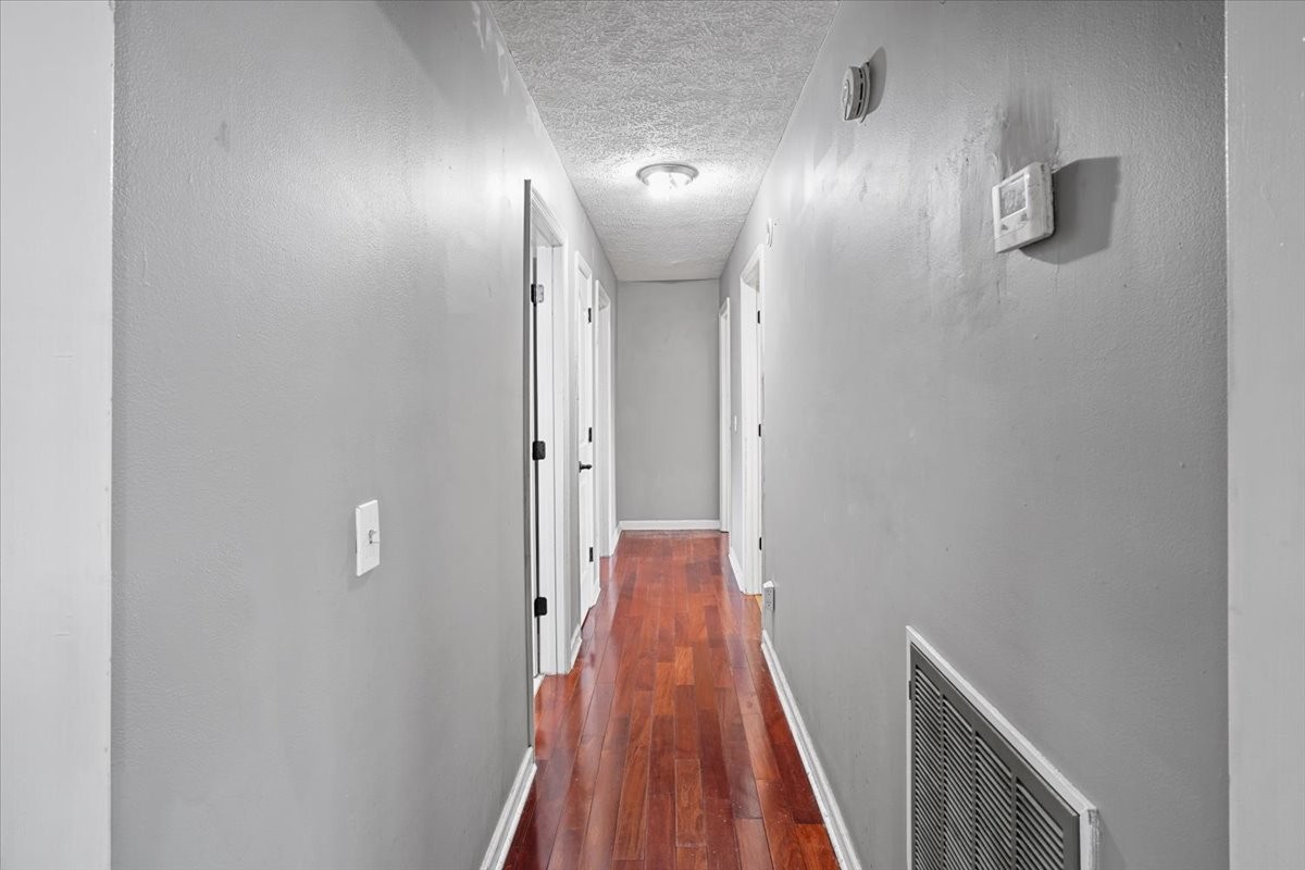 1306 Cason Trail Murfreesboro, TN 37128 - Photo 18 of 38 a view of a hallway with wooden floor