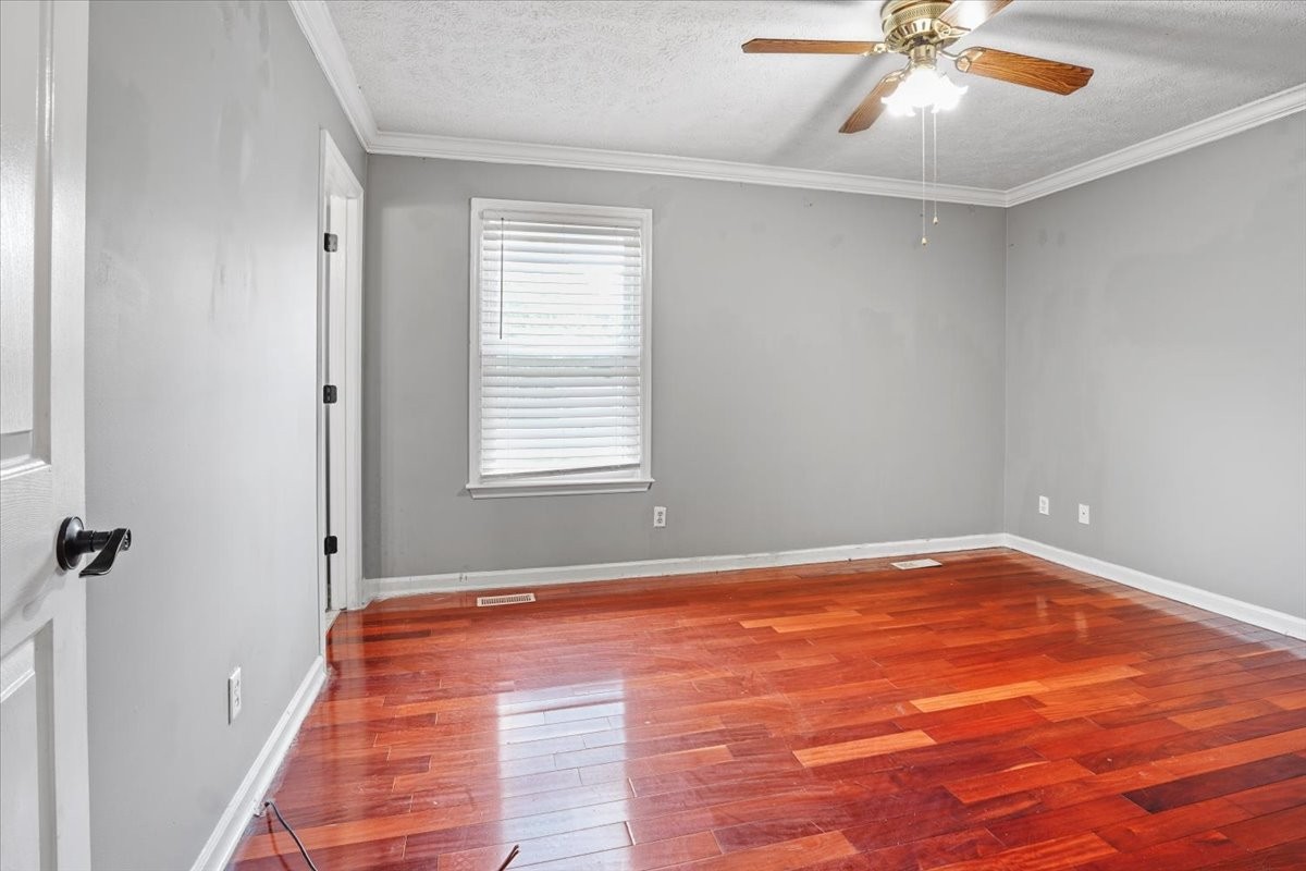 1306 Cason Trail Murfreesboro, TN 37128 - Photo 19 of 38 wooden floor in an empty room with a window