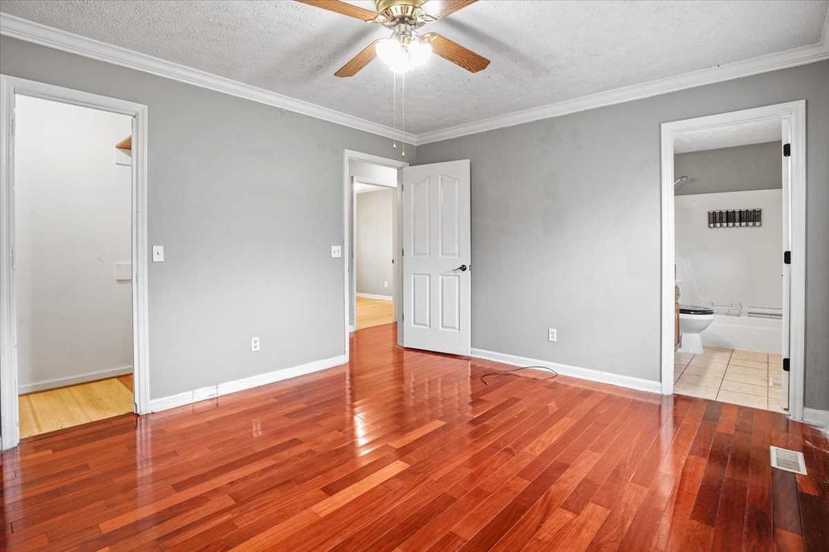 1306 Cason Trail Murfreesboro, TN 37128 - Photo 20 of 38 an empty room with wooden floor and door