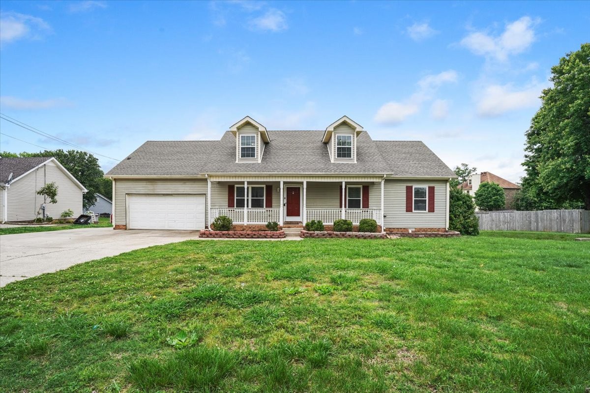 1306 Cason Trail Murfreesboro, TN 37128 - Photo 2 of 38 a front view of a house with yard patio and green space