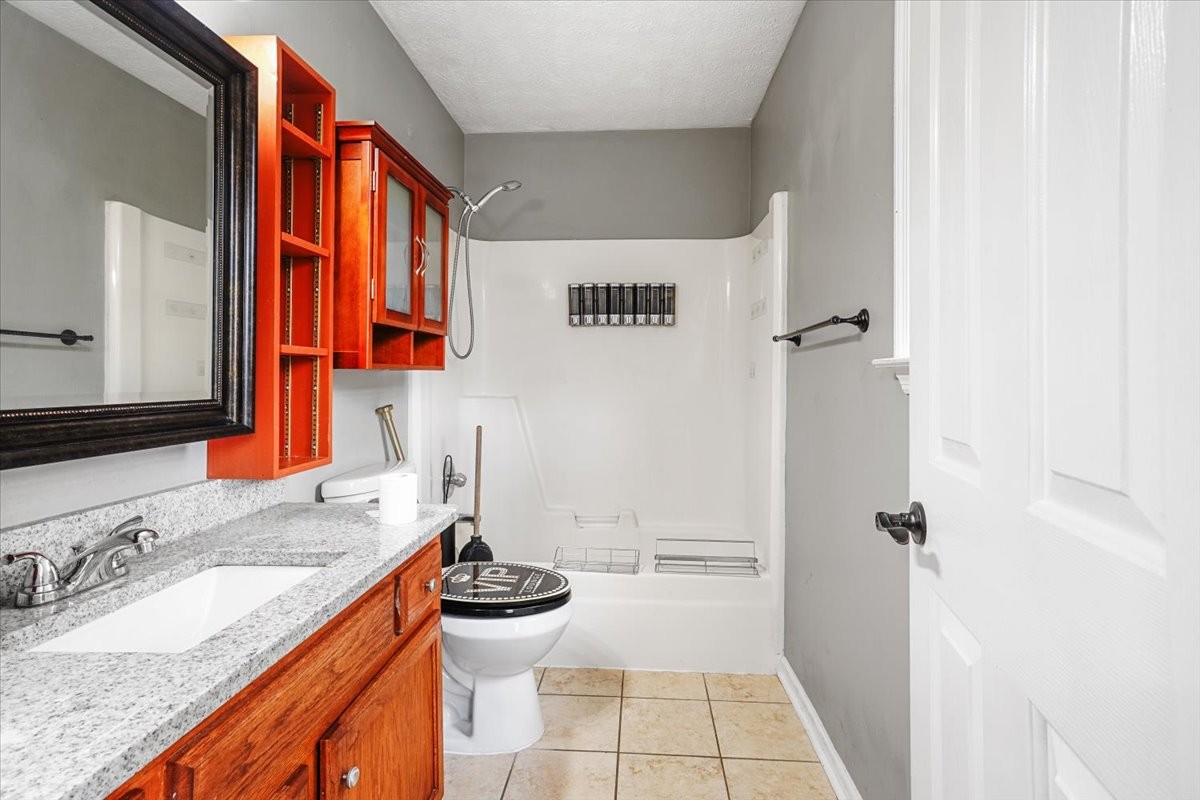 1306 Cason Trail Murfreesboro, TN 37128 - Photo 21 of 38 a bathroom with a granite countertop sink and a mirror