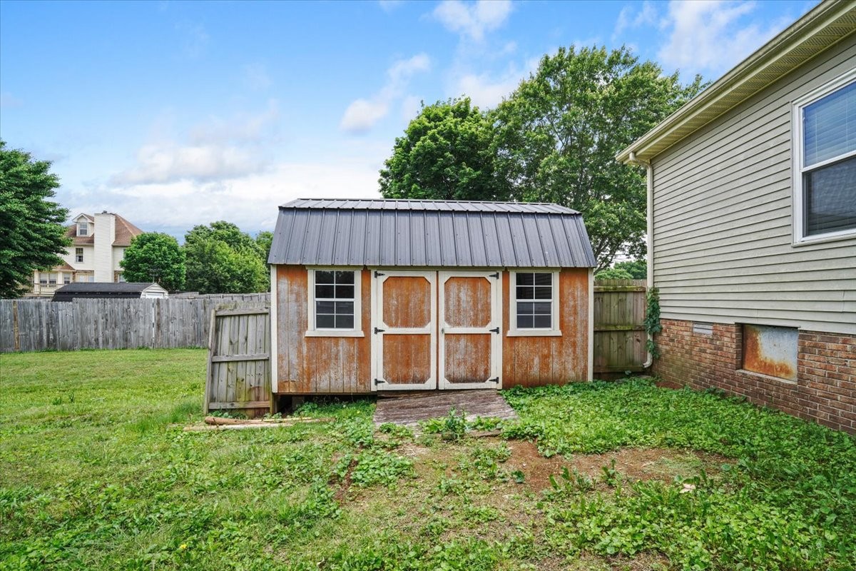 1306 Cason Trail Murfreesboro, TN 37128 - Photo 35 of 38 a view of backyard with wooden fence and large trees