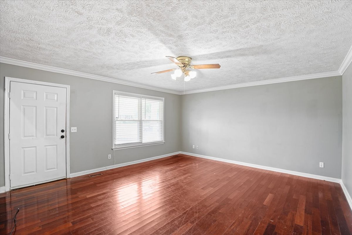 1306 Cason Trail Murfreesboro, TN 37128 - Photo 4 of 38 wooden floor in an empty room with a window