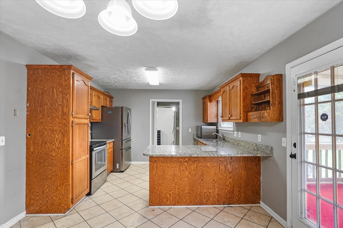 1306 Cason Trail Murfreesboro, TN 37128 - Photo 7 of 38 a bathroom with a granite countertop sink and a mirror