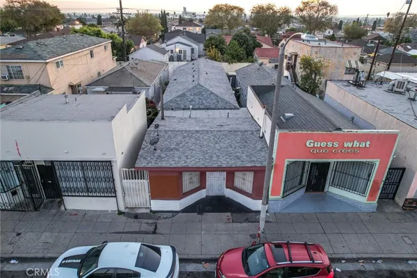 an aerial view of a house with parking space
