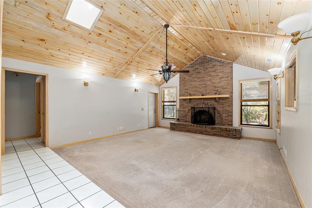 2023 Southwest 76 Terrace Gainesville, FL 32607 - Photo 17 of 95 a view of empty room with fireplace and window