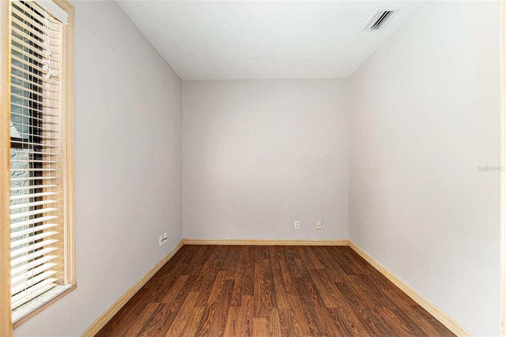 2023 Southwest 76 Terrace Gainesville, FL 32607 - Photo 20 of 95 a view of a room with wooden floor and a window