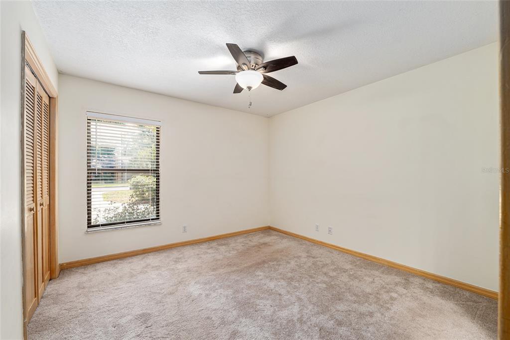 2023 Southwest 76 Terrace Gainesville, FL 32607 - Photo 23 of 95 an empty room with windows and fan
