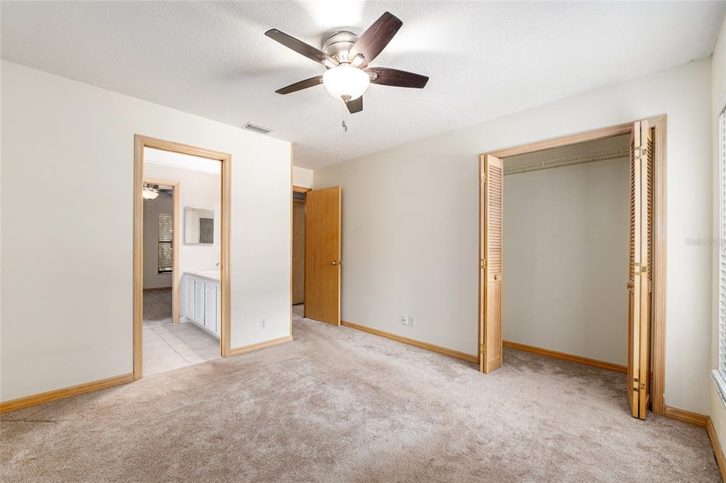 2023 Southwest 76 Terrace Gainesville, FL 32607 - Photo 24 of 95 a view of an empty room and a ceiling fan