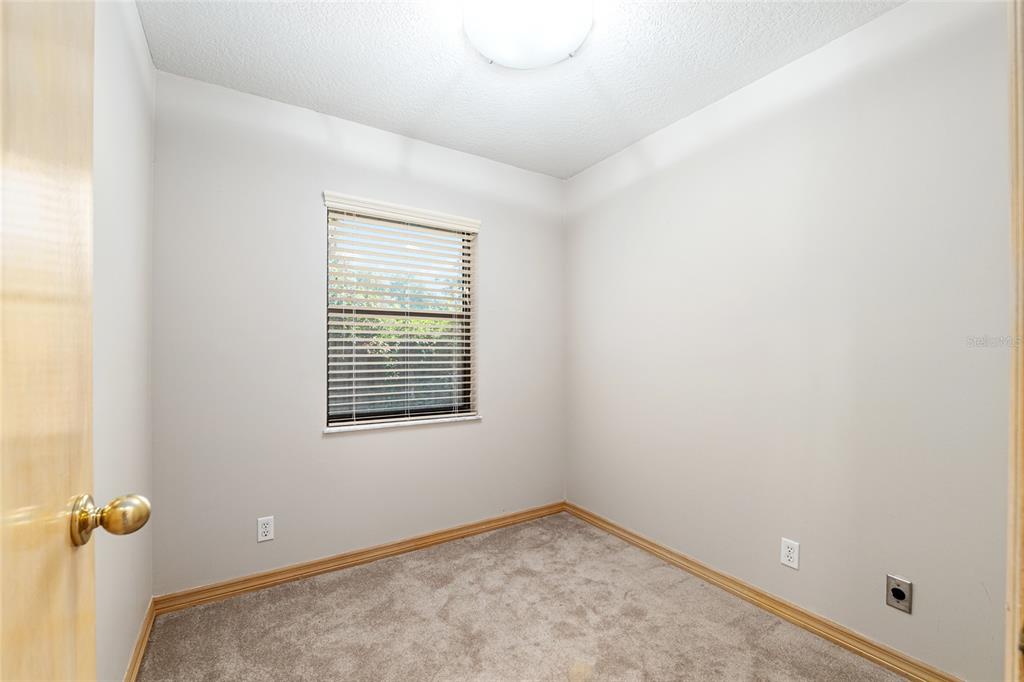 2023 Southwest 76 Terrace Gainesville, FL 32607 - Photo 28 of 95 a view of a room with rack on the wall and a window