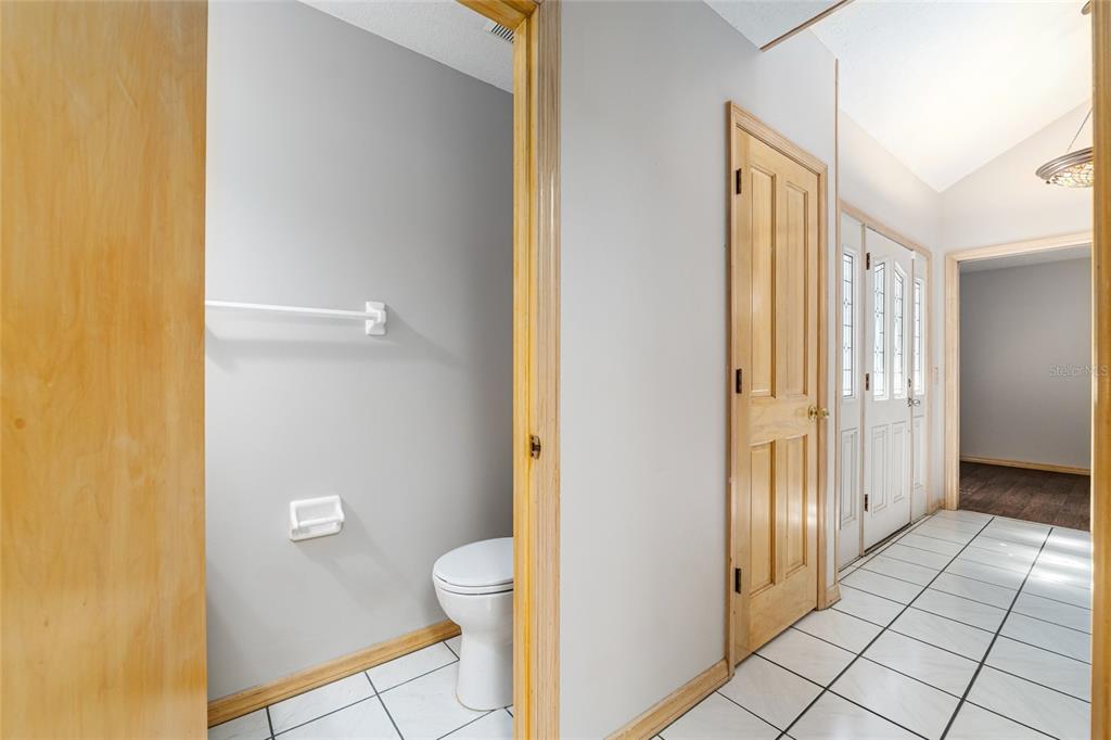 2023 Southwest 76 Terrace Gainesville, FL 32607 - Photo 29 of 95 a bathroom with a granite countertop shower and a toilet