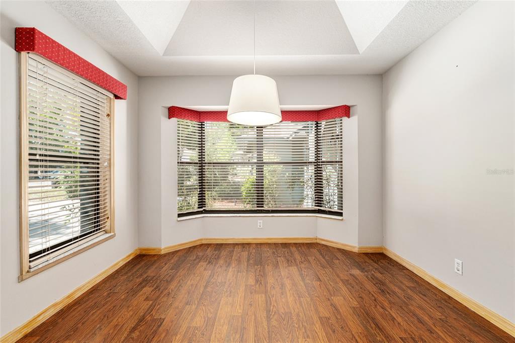 2023 Southwest 76 Terrace Gainesville, FL 32607 - Photo 33 of 95 a view of a room with wooden floor and windows