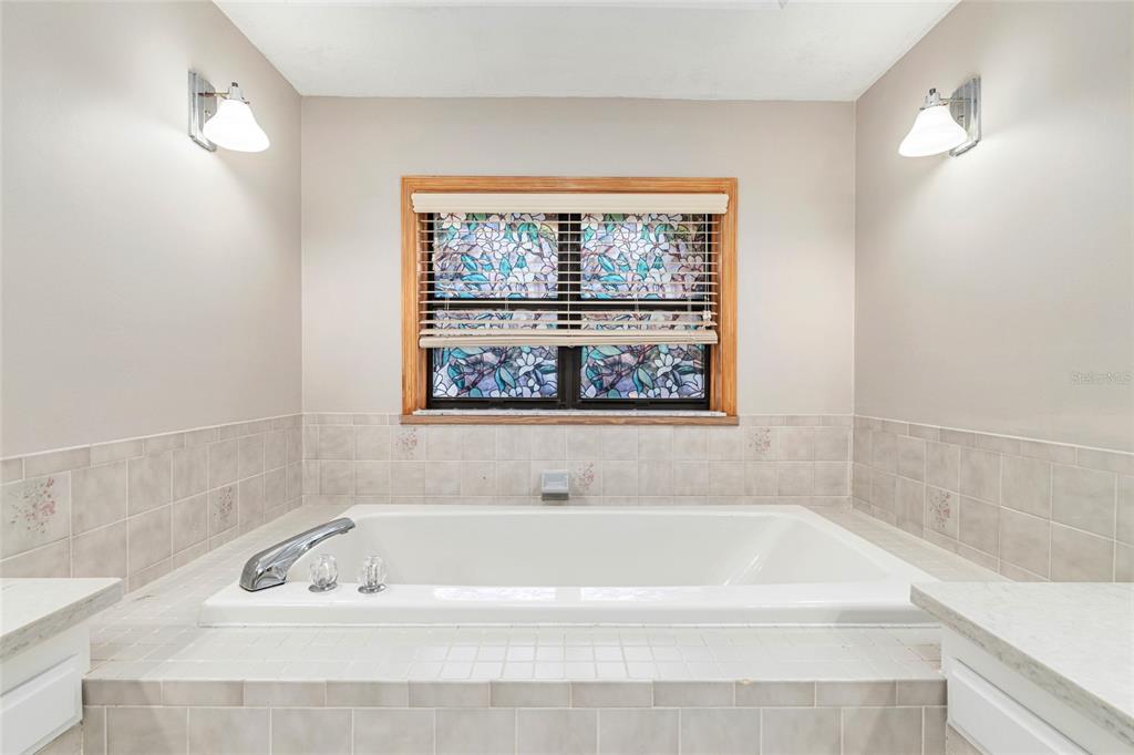 2023 Southwest 76 Terrace Gainesville, FL 32607 - Photo 52 of 95 a bathroom with a bathtub