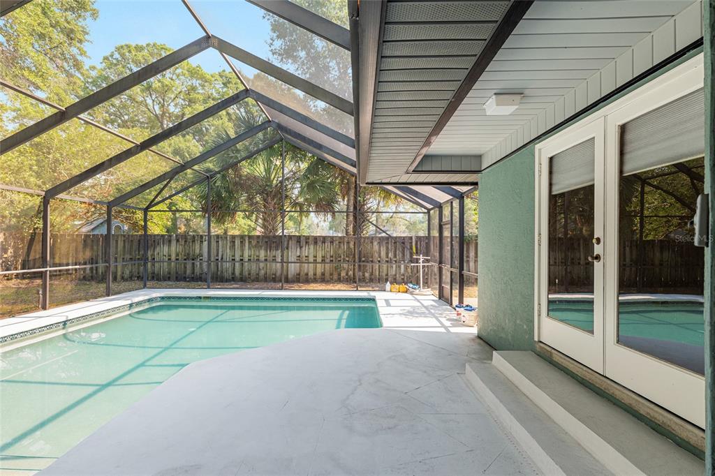 2023 Southwest 76 Terrace Gainesville, FL 32607 - Photo 64 of 95 a view of swimming pool with a outdoor seating