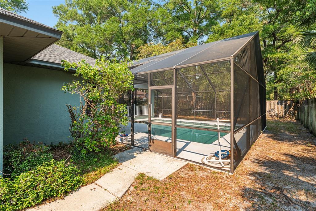 2023 Southwest 76 Terrace Gainesville, FL 32607 - Photo 68 of 95 a view of backyard with wooden fence and a large tree