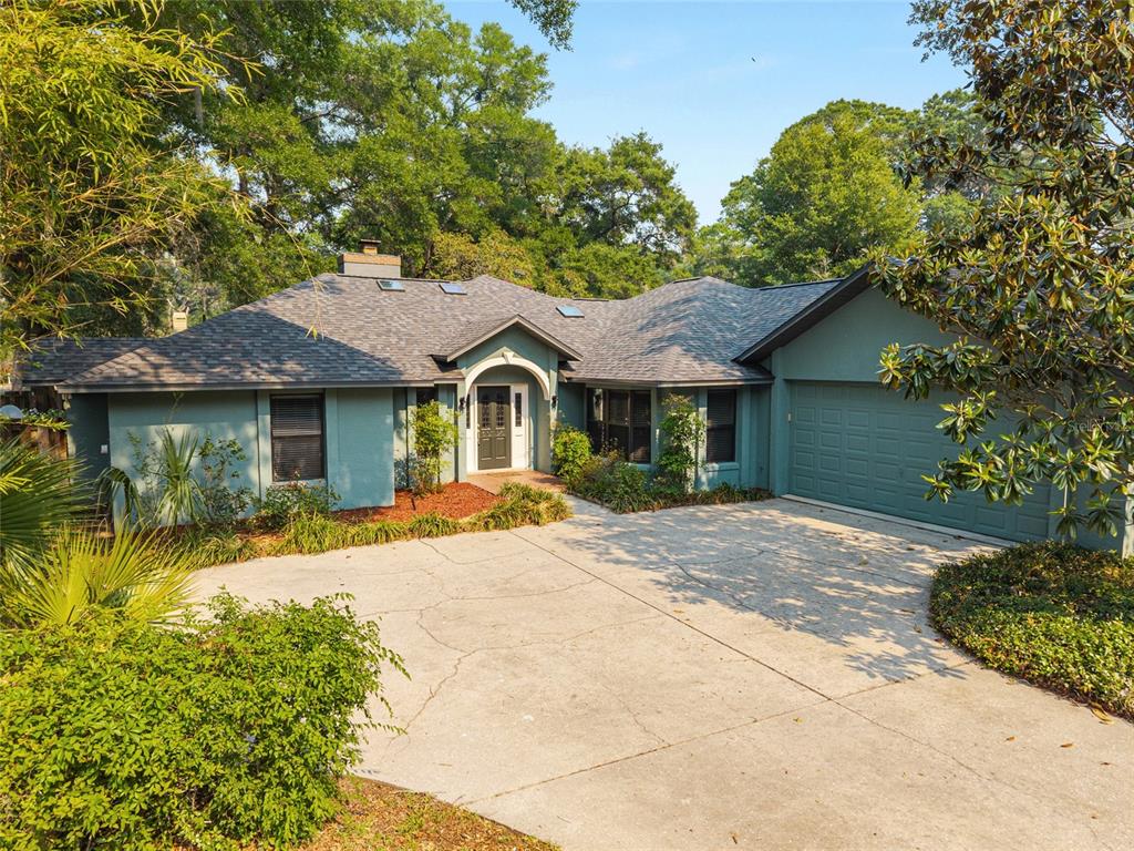 2023 Southwest 76 Terrace Gainesville, FL 32607 - Photo 72 of 95 a front view of a house with a garden