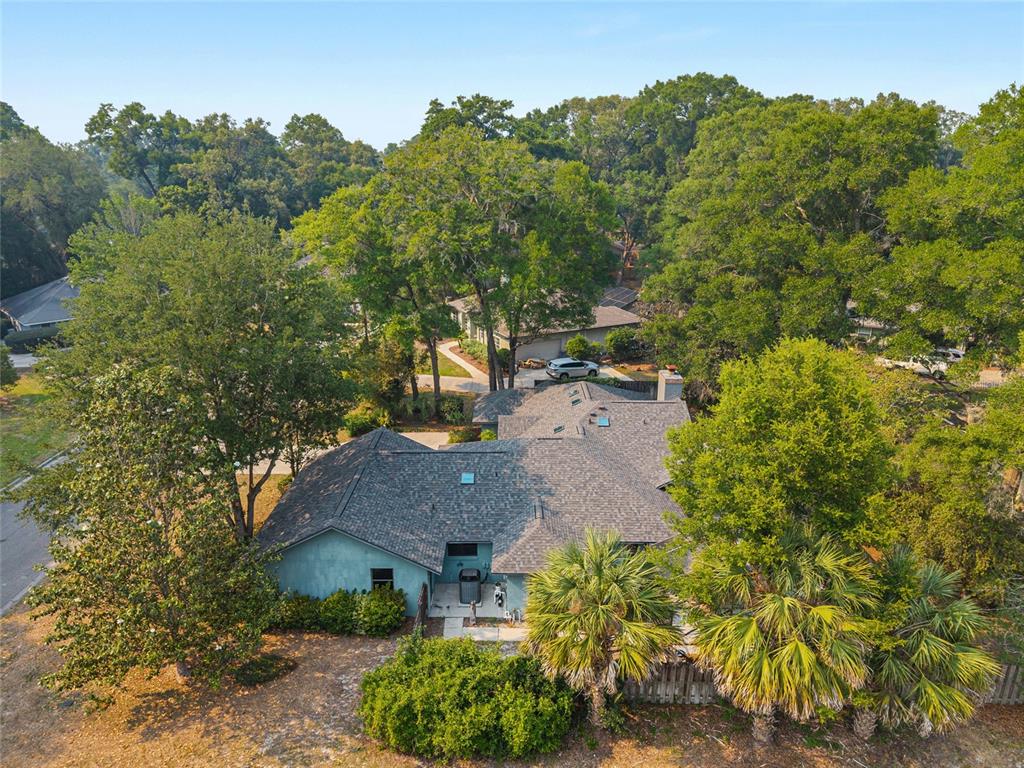 2023 Southwest 76 Terrace Gainesville, FL 32607 - Photo 80 of 95 an aerial view of a house with yard and green space
