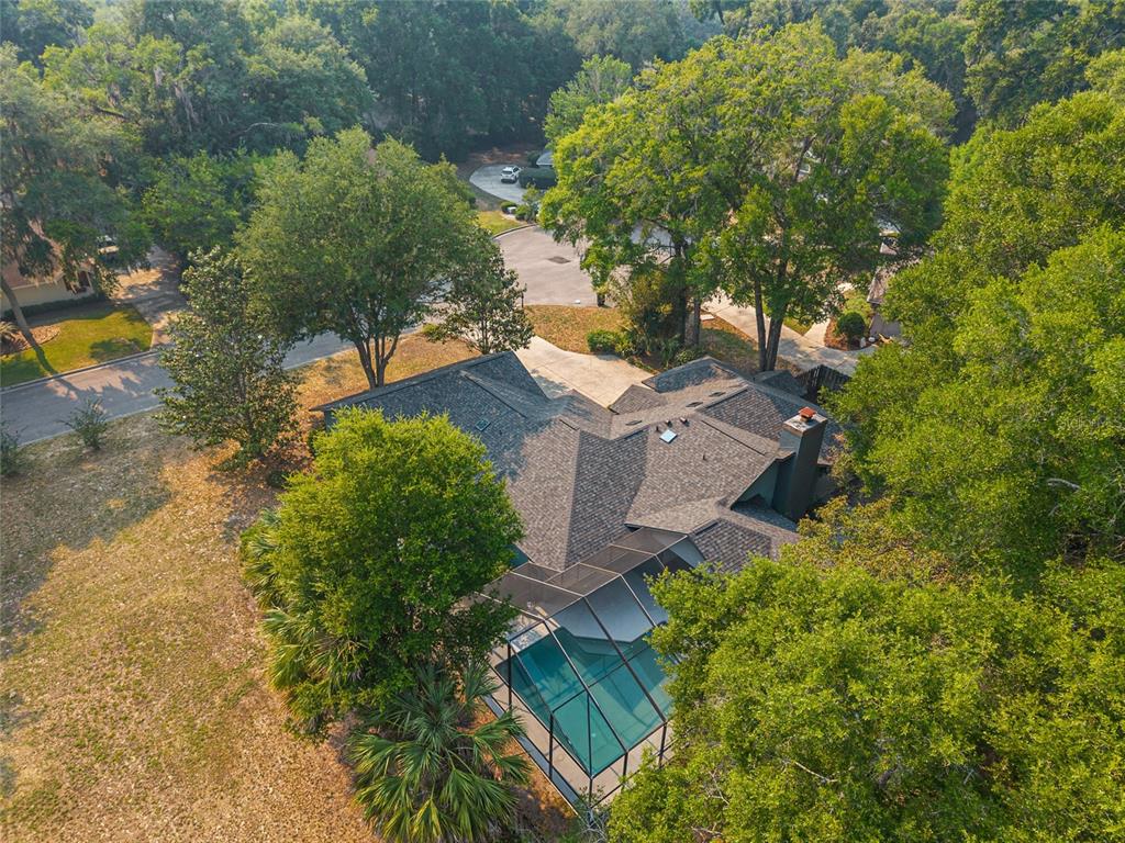 2023 Southwest 76 Terrace Gainesville, FL 32607 - Photo 83 of 95 an aerial view of a house with swimming pool and garden space