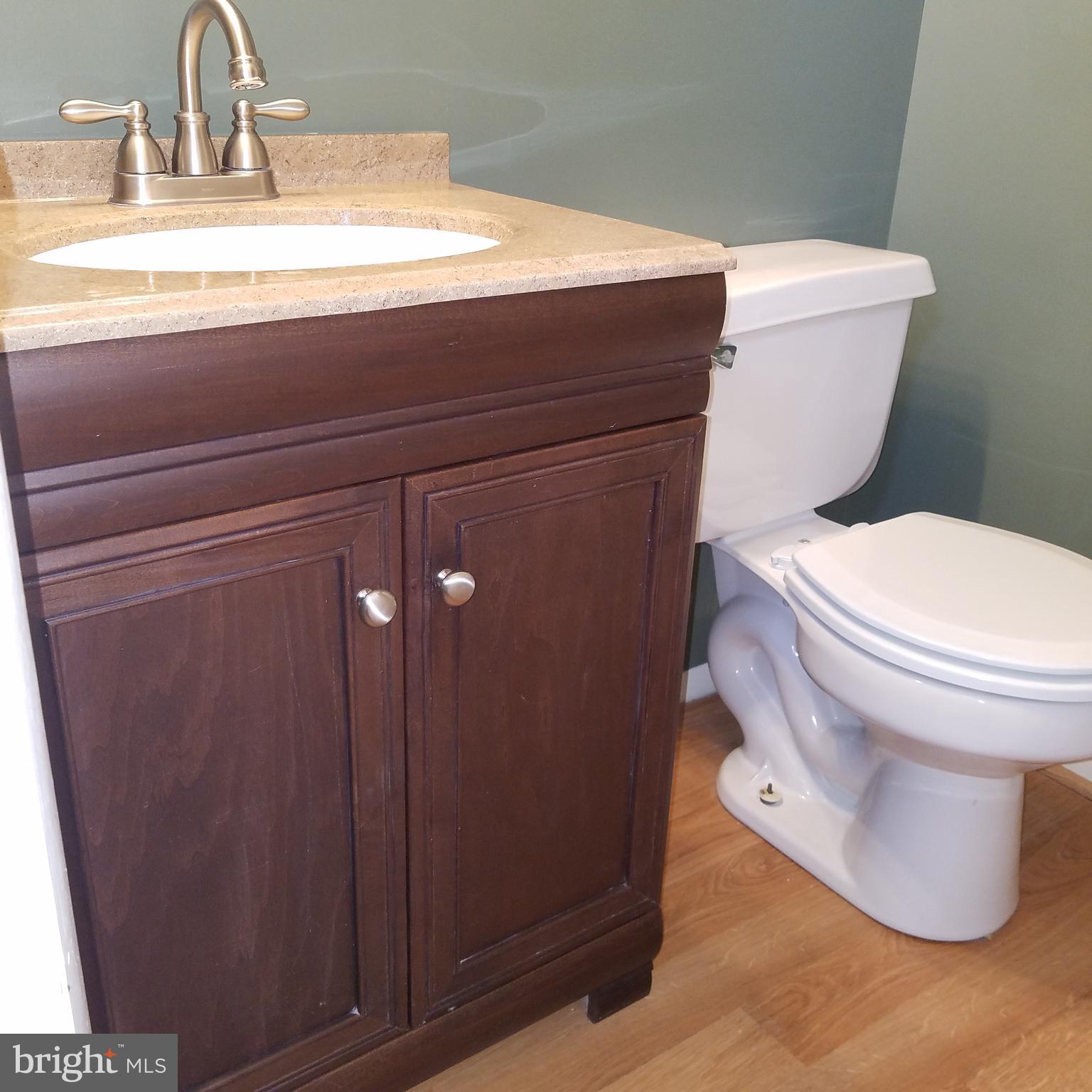 5460 Bethlehem Road Preston, MD 21655 - Photo 16 of 25 a bathroom with a toilet and a sink