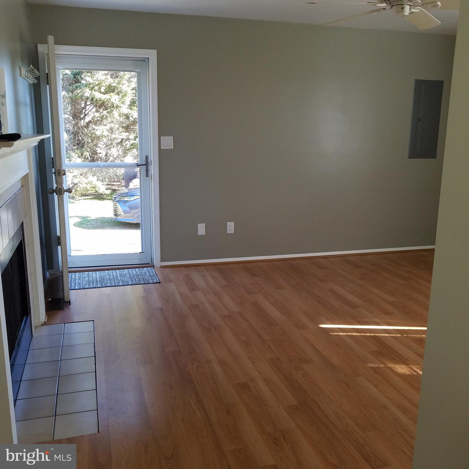 5460 Bethlehem Road Preston, MD 21655 - Photo 18 of 25 a view of a livingroom with wooden floor and a fireplace