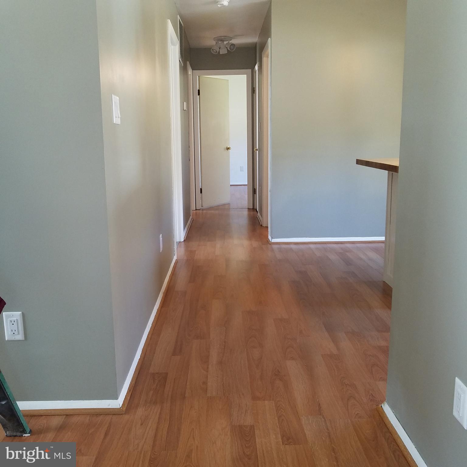 5460 Bethlehem Road Preston, MD 21655 - Photo 5 of 25 a view of a hallway with wooden floor