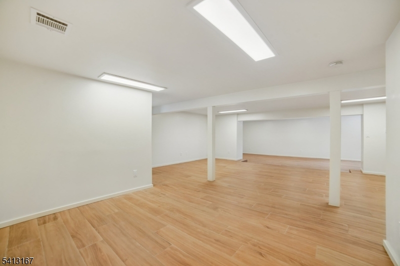 156 Park Road Parsippany, NJ 07054 - Photo 35 of 44 a view of empty room with wooden floor