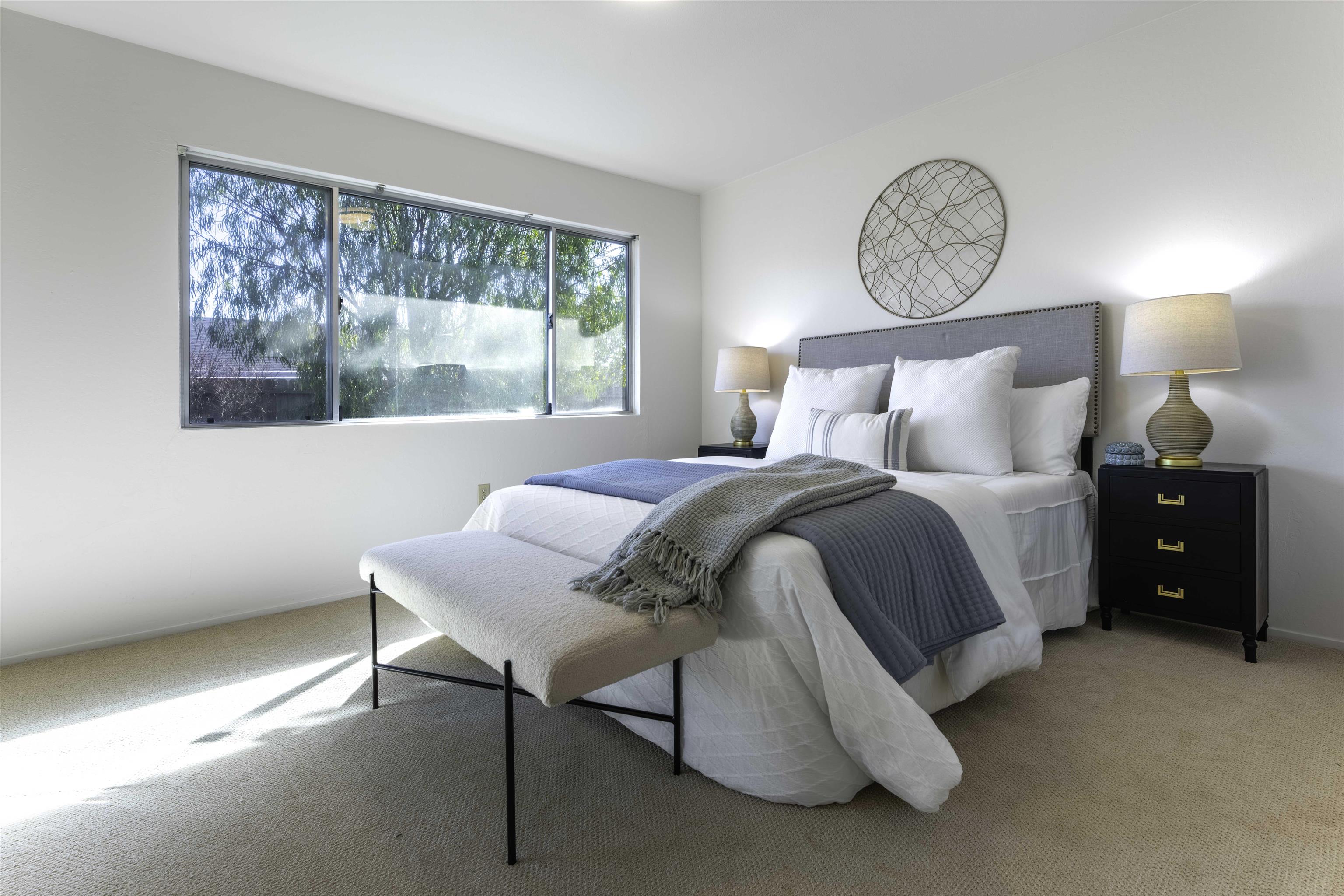 20 Fircrest Court San Ramon, CA 94583 - Photo 19 of 38 a bedroom with a bed a lamp and a window